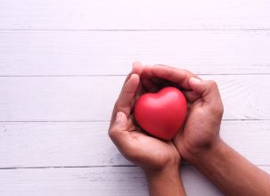 picture of a heart being help in hands