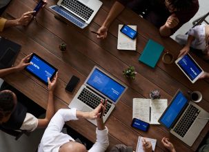 picture of laptops with people working on them